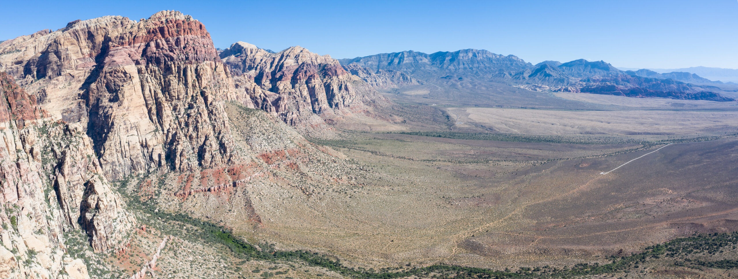 An aerial view shows a beautiful mountain landscape that rises from the desert surrounding Las Vegas, Nevada. This desert area averages over 95 degrees F during summer months.